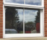 Рулонная москитная сетка на окно с вертикальным сдвигом OPERA